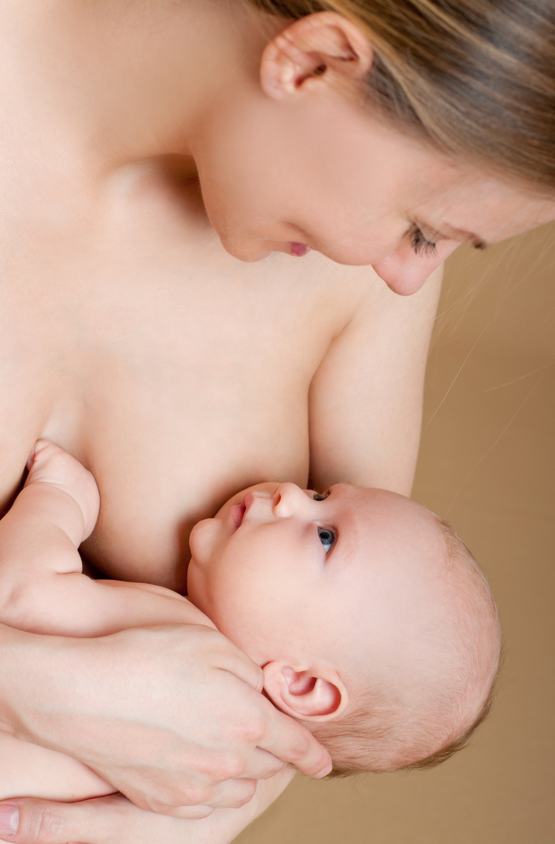 Mother breast feeding her infant
